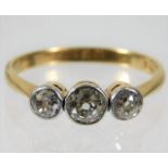 A Victorian 18ct gold ring set with three diamonds