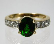 A 9ct gold ring set with approx. 0.25ct diamond & tourmaline 3.7g size N/O