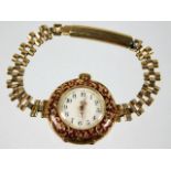 An 18ct gold & enamel cased wrist watch with plate