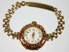 An 18ct gold & enamel cased wrist watch with plate