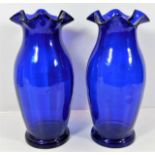 A pair of Victorian Bristol blue glass vases with