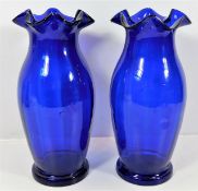 A pair of Victorian Bristol blue glass vases with