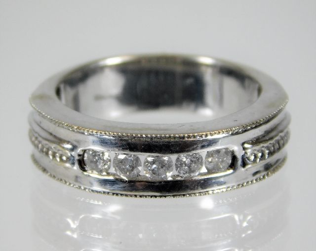 A 9ct white gold ring set with five diamonds of approx. 0.35ct 5.6g size N/O