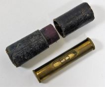 A brass level with case