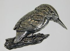 A white metal kingfisher pin brooch with script in