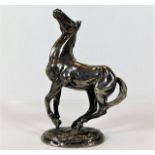 A solid silver model of a horse by Lorrie McClean
