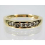 A yellow metal ring, tests as 9ct gold, set with a