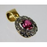 A 14ct gold pendant set with diamond & ruby 1.7g