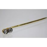 A yellow metal tie pin set with two diamonds 1.3g