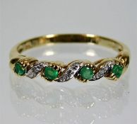 A 9ct gold emerald & diamond ring 2g size Q