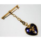 A yellow metal brooch & enamelled locket with chain, tests as 18ct gold, 8.9g