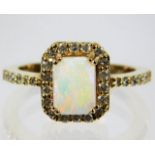 A 14ct gold diamond & opal ring 5g size O