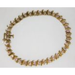 A 10ct gold bracelet with approx. 2.6ct diamonds 8