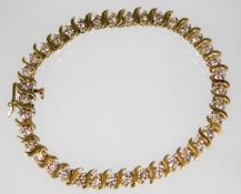 A 10ct gold bracelet with approx. 2.6ct diamonds 8