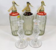 Three vintage soda syphons twinned with a pair of