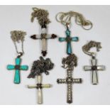 Six silver & white metal crosses with chains set w