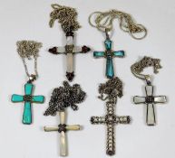 Six silver & white metal crosses with chains set w