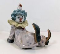 A Lladro clown figurine seated pattern no. 5812 4.