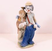 A Lladro clown figure group with girl & puppies pa