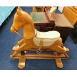 A 20thC. childs pine rocking horse 44.5in H x 55in