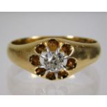 A gents antique 18ct gold gypsy style ring set wit