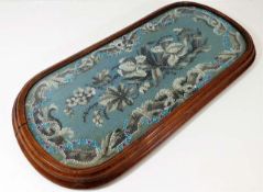 A Victorian beadwork tray with walnut surround 27.