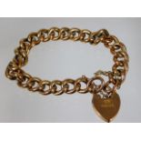 A 9ct gold bracelet with padlock clasp & 9ct marke