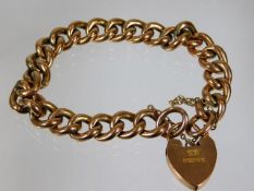 A 9ct gold bracelet with padlock clasp & 9ct marke