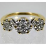 An 18ct gold trilogy style ring set with approx. 1