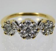 An 18ct gold trilogy style ring set with approx. 1