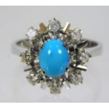 An 18ct white gold ring set with diamond & turquoi