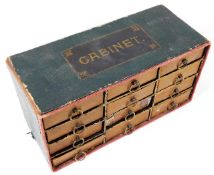 A c.1900 small box of drawers with buttons content