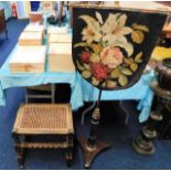 A rosewood & brass firescreen with woolwork screen