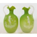 A pair of lime coloured satin glass Mary Gregory j