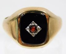 A 9ct gold signet ring set with red stone 5.5g siz