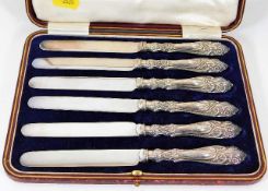 A boxed set of silver handled fruit knives