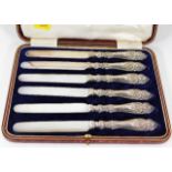 A boxed set of silver handled fruit knives