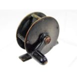 A bronze fishing reel