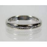 An 18ct half eternity ring set with approx. 25 diamonds 4.2g size N