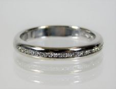 An 18ct half eternity ring set with approx. 25 diamonds 4.2g size N