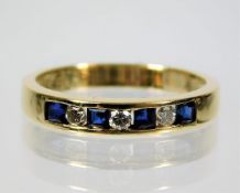 A 14ct gold diamond & sapphire ring set with approx. 0.15ct diamond 2.6g size O