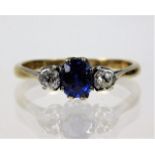 A 9ct gold ring with platinum set sapphire & appro