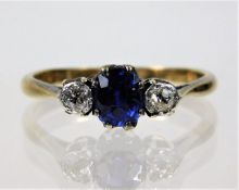 A 9ct gold ring with platinum set sapphire & appro