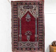A mid 20thC. Islamic prayer rug 59in x 38.5in