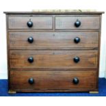 A Georgian mahogany chest of drawers with ebonised