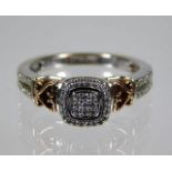 A 10ct two colour gold ring set with diamonds 4g s