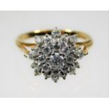 An 18ct gold diamond cluster ring set with 1ct dia