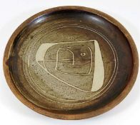 A Bernard Leach stoneware bowl with stylised face design, mark to base, made for & sold to Dr. J.C.S