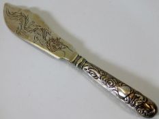 A Chinese silver knife with embossed decor to hand