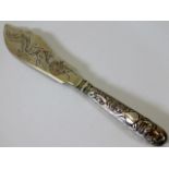 A Chinese silver knife with embossed decor to hand